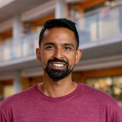 Man smiling looking at photo