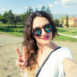 Woman in sunglasses taking a selfie